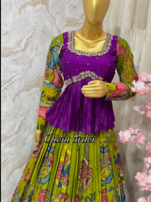 Exclusive designer hand painted pen Kalamkari lehenga paired up with maggam work peplum top ….