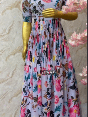 Exclusive designer floral long gown having maggam highlights on yoke part and hands