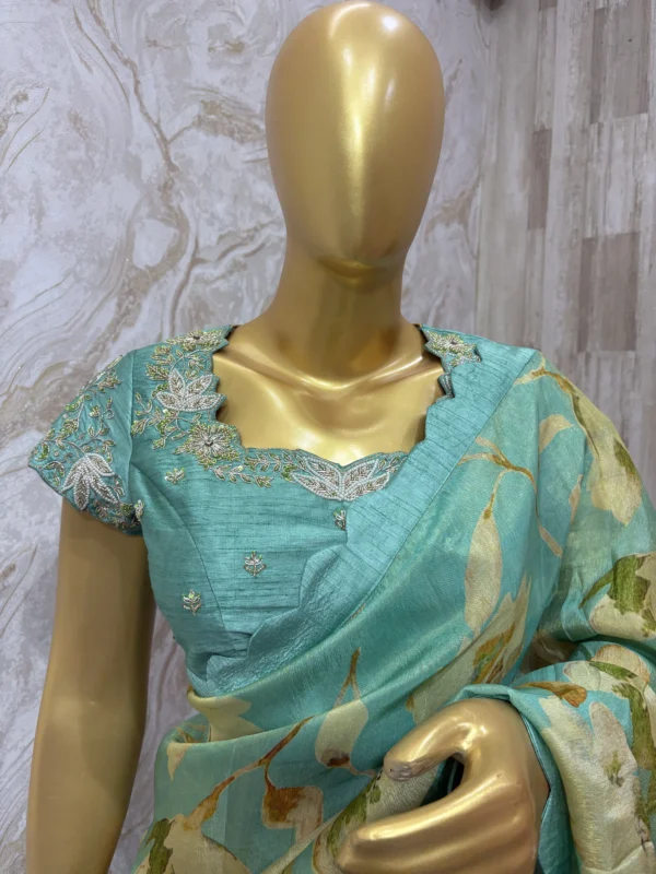 Floral tissue saree paired with beautiful maggam work blouse