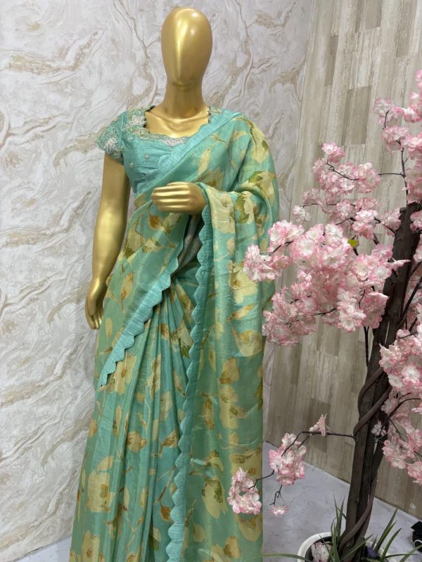 Floral tissue saree paired with beautiful maggam work blouse