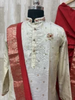Pure tissue kurta having beautiful maggam work on collar, hands & chest part paired with red dhoti and kanduva