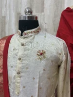 Pure tissue kurta having beautiful maggam work on collar, hands & chest part paired with red dhoti and kanduva
