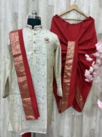 Pure tissue kurta having beautiful maggam work on collar, hands & chest part paired with red dhoti and kanduva