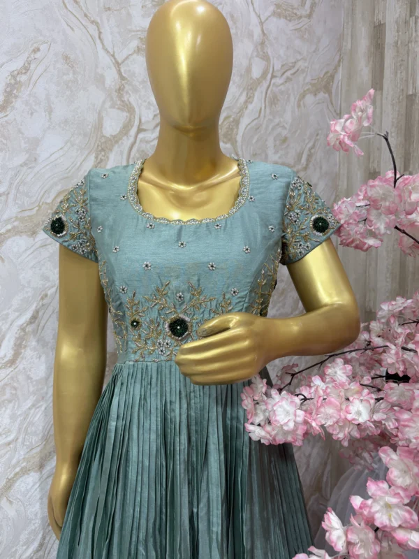 Crepe silk long gown having beautiful maggam worn on yoke part