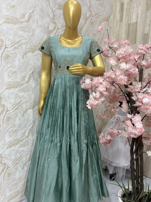 Crepe silk long gown having beautiful maggam worn on yoke part