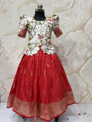 Kids banaras pattu lehenga paired up with beautiful kalamkari maggam work blouse