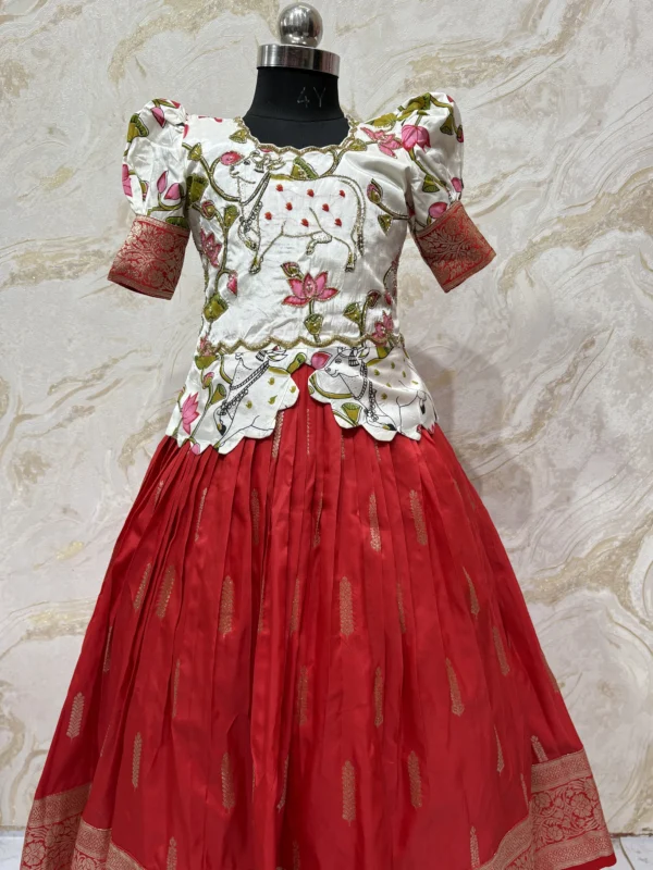 Kids banaras pattu lehenga paired up with beautiful kalamkari maggam work blouse