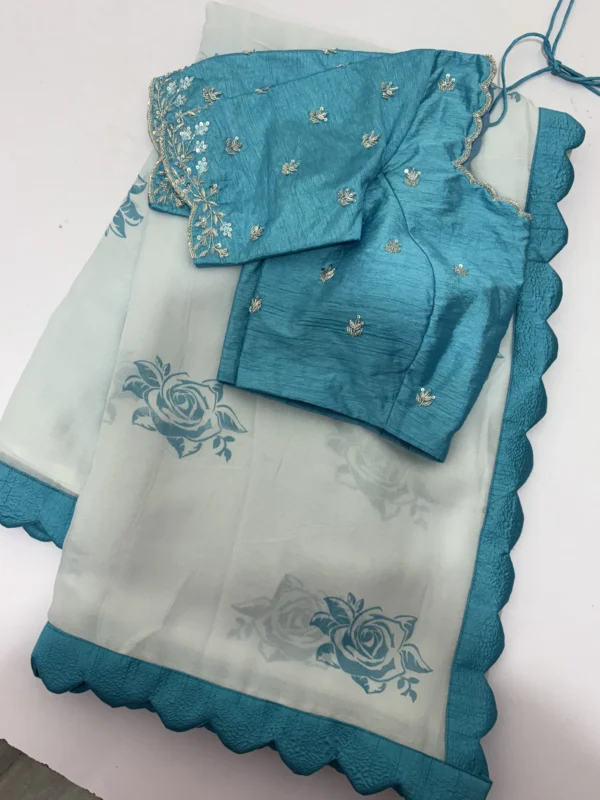 Pure georgette saree having pretty scalap border paired with maggam work blouse
