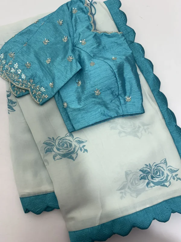 Pure georgette saree having pretty scalap border paired with maggam work blouse