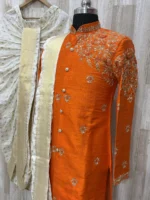 Pure raw silk Orange sherwani having maggam work on shoulder part paired with dhoti & kanduva