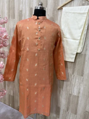 Tissue kurta with brocade weaving paired with cream colour pijama