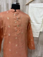 Tissue kurta with brocade weaving paired with cream colour pijama