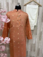 Tissue kurta with brocade weaving paired with cream colour pijama