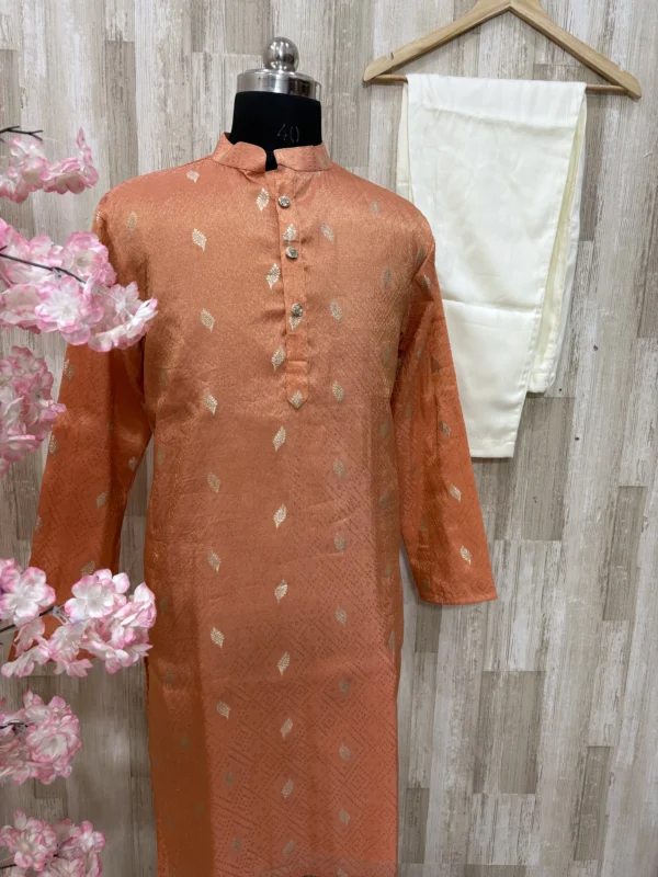 Tissue kurta with brocade weaving paired with cream colour pijama
