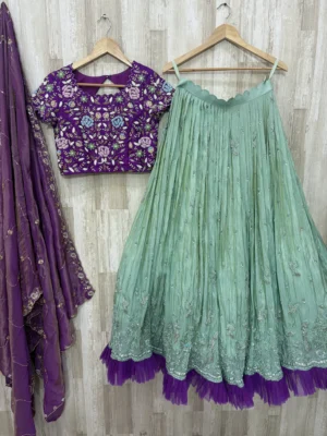 Trending tissue hand work lehenga paired with heavy maggam work blouse & dupatta