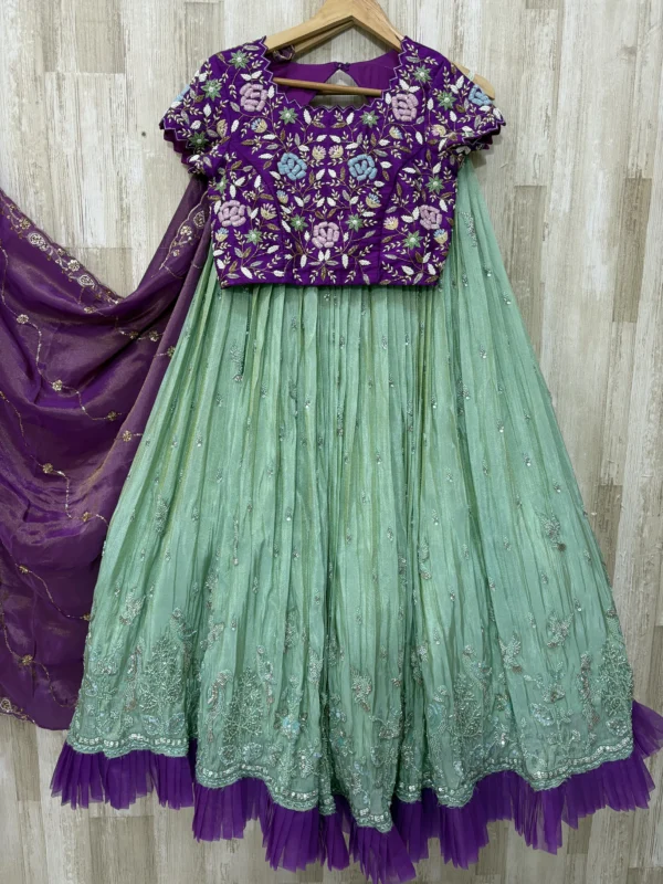 Trending tissue hand work lehenga paired with heavy maggam work blouse & dupatta