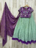 Trending tissue hand work lehenga paired with heavy maggam work blouse & dupatta