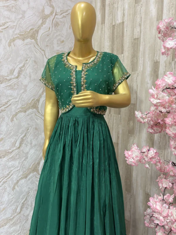 Long gown with heavy flare paired with beautiful maggam work jacket