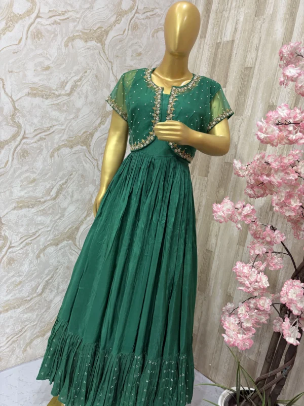 Long gown with heavy flare paired with beautiful maggam work jacket