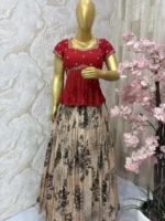 Floral tissue skirt paired with beautiful maggam work peplum blouse