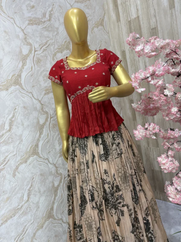 Floral tissue skirt paired with beautiful maggam work peplum blouse
