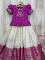 Tissue lehenga with pattu border paired with beautiful maggam work blouse