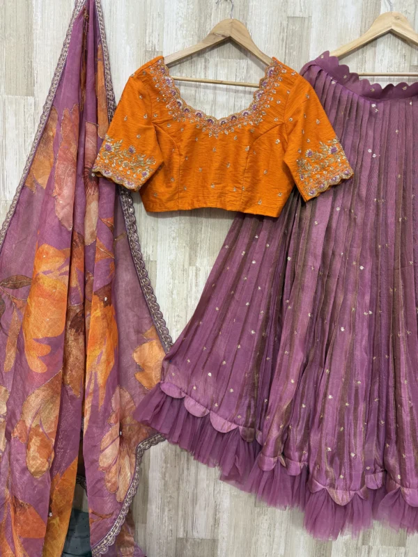 Tissue lehenga with beautiful maggam work blouse and dupatta