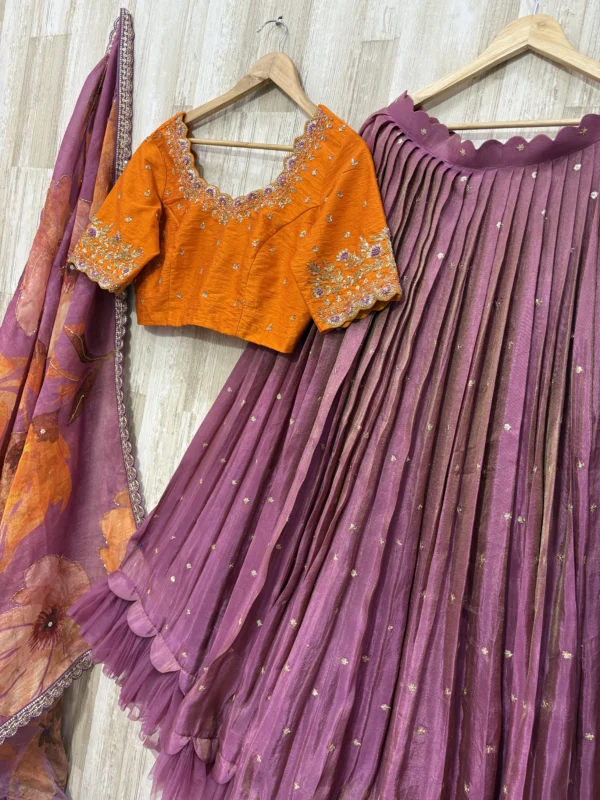 Tissue lehenga with beautiful maggam work blouse and dupatta