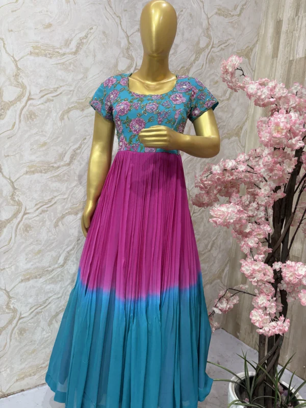 Dual shade long gown with floral yoke part and heavy maggam work