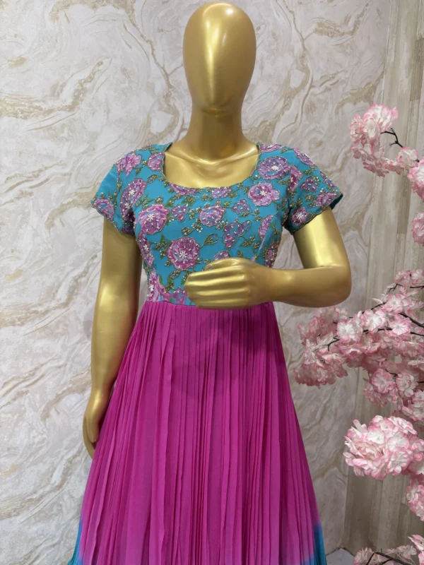 Dual shade long gown with floral yoke part and heavy maggam work