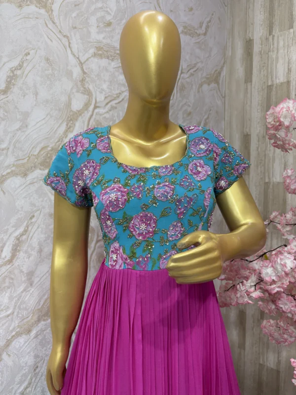 Dual shade long gown with floral yoke part and heavy maggam work
