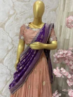Tissue lehenga with beautiful pattu border paired up with maggam work blouse & rich dupatta