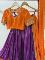 Designer lehenga with pattu border paired with beautiful maggam work blouse & contrast dupatta