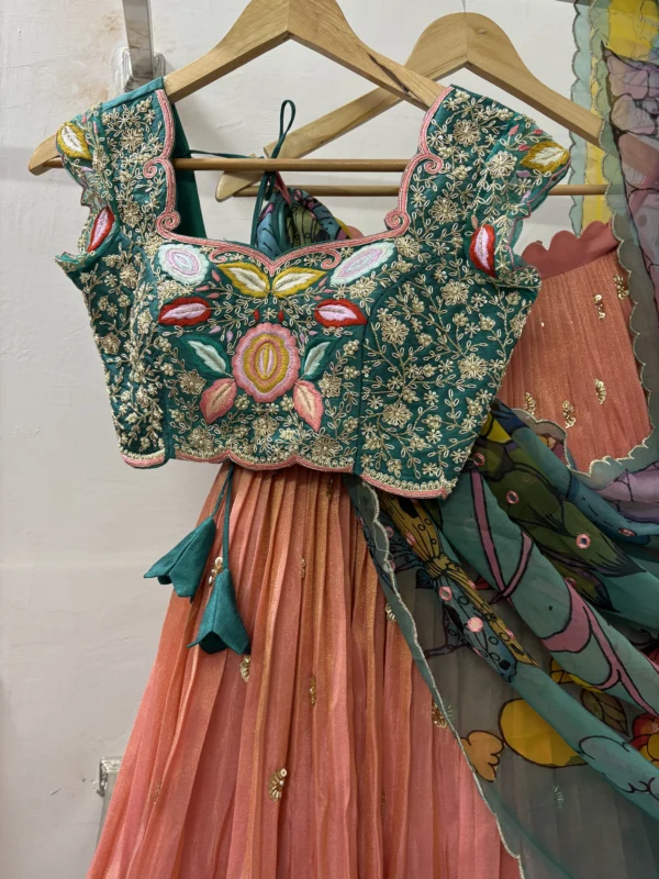 Tissue lehenga paired up with heavy maggam work blouse & pure pen kalamkari organza dupatta