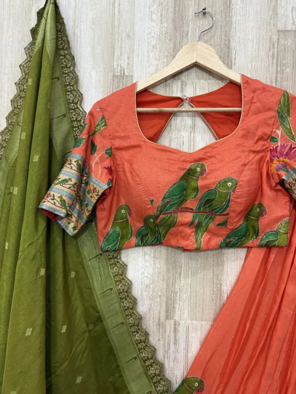 Trending orange colour lehenga & blouse paired with muniya dupatta