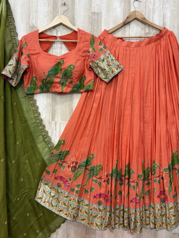 Trending orange colour lehenga & blouse paired with muniya dupatta