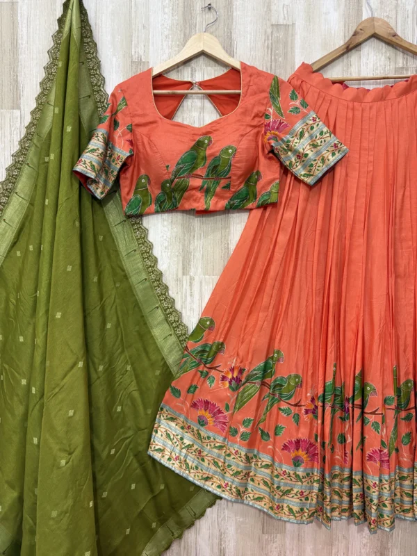 Trending orange colour lehenga & blouse paired with muniya dupatta