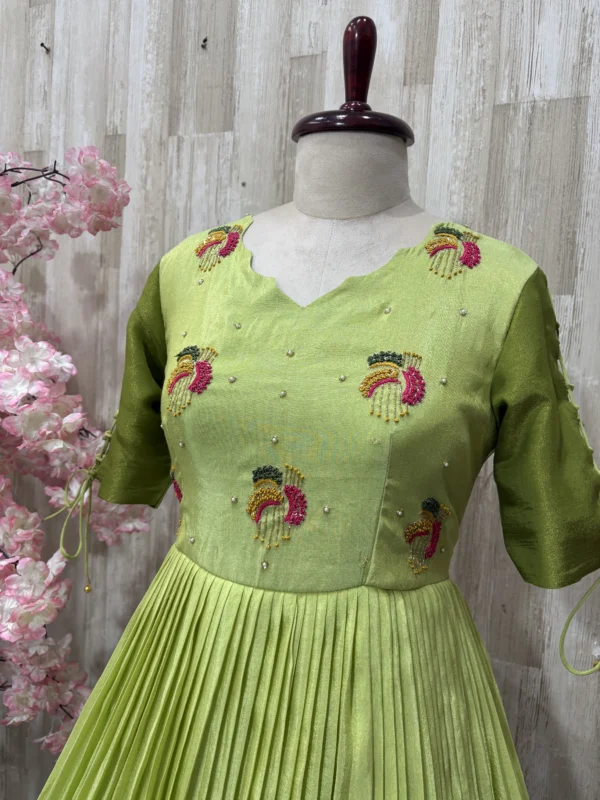 Dual shade maggam work long gown with heavy flare