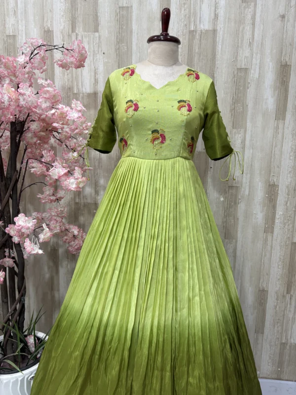 Dual shade maggam work long gown with heavy flare