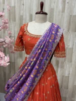 Trending orange lehenga paired with beautiful maggam work & patola silk dupatta