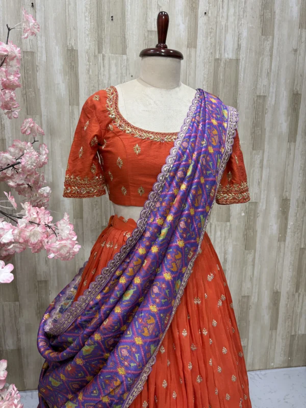 Trending orange lehenga paired with beautiful maggam work & patola silk dupatta