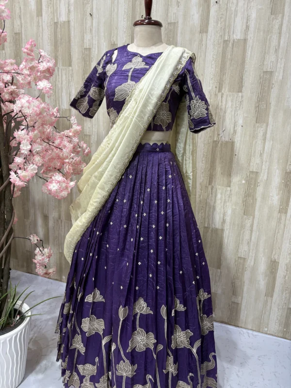 Applique work lehenga blouse paired with beautiful hand work tissue dupatta