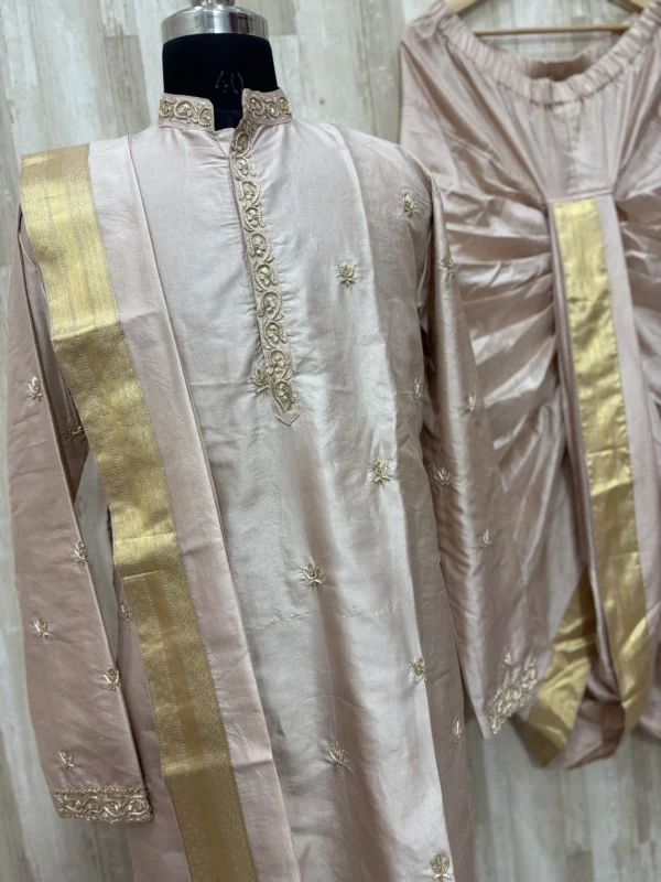 Pure pattu men's kurta with beautiful maggam work paired with matching dhoti & kanduva