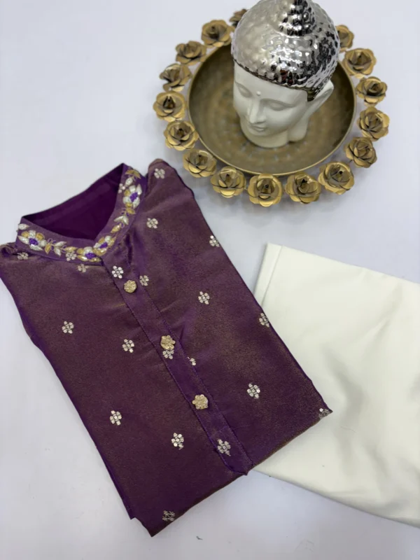 Tissue men's kurta having all over sequin bootis and maggam work on collar paired with cream colour pijama