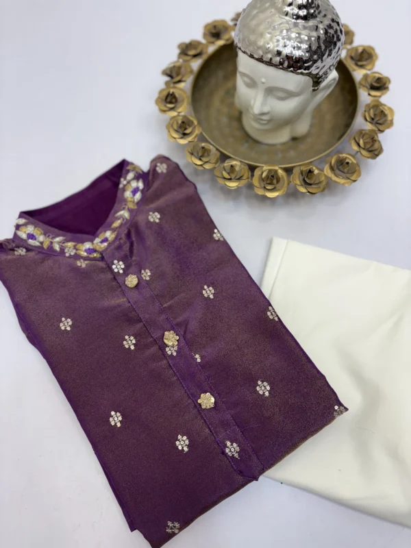 Tissue men's kurta having all over sequin bootis and maggam work on collar paired with cream colour pijama