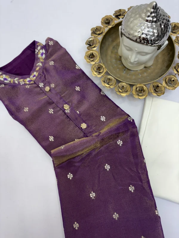 Tissue men's kurta having all over sequin bootis and maggam work on collar paired with cream colour pijama