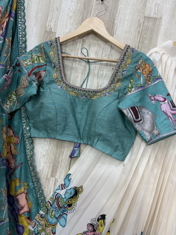 Kalamkari hand work lehenga paired with beautiful maggam work blouse & kalamkari dupatta