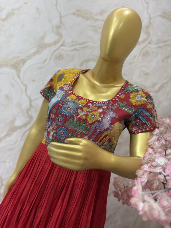 Hand painted pen kalamkari long gown having heavy maggam work