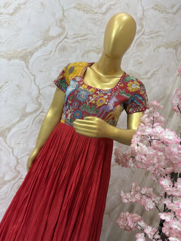 Hand painted pen kalamkari long gown having heavy maggam work