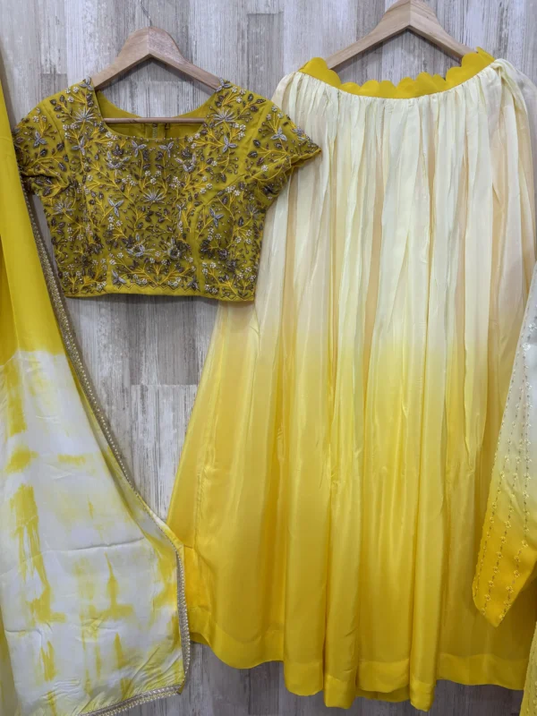 Dual shade lehenga paired with heavy maggam work blouse & dupatta